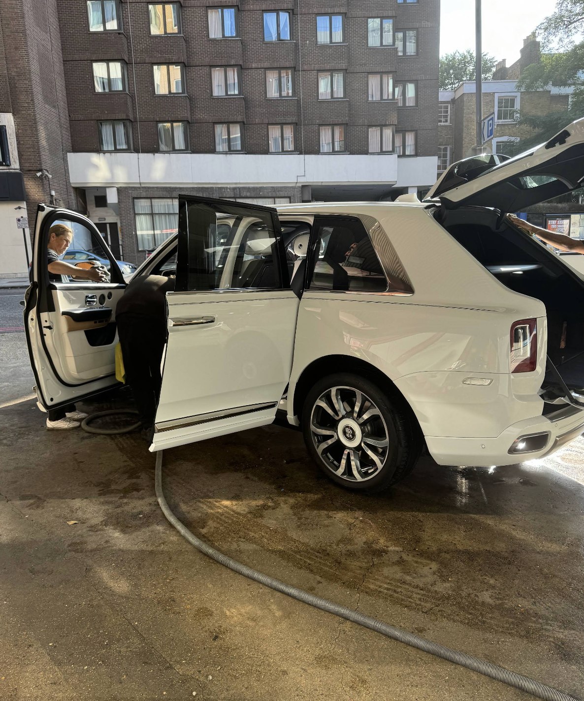 Rolls-Royce Cullinan: doors open at the bay at Kensington's Car Wash
